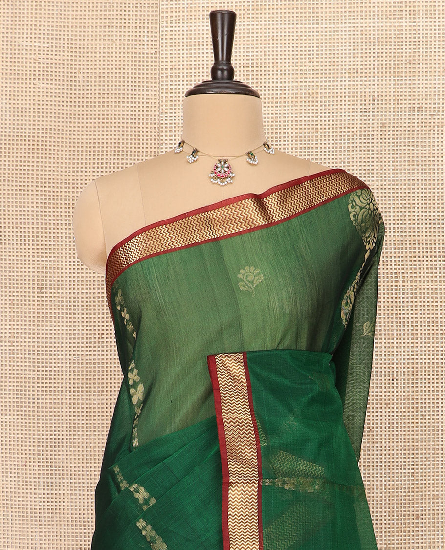 Green Silk Cotton Saree Beautified with Buttas All Over the Body, Complemented by a Contrast Chevron Striped Zari Border, Featuring a Contrast Pallu Steeped With Geometric Designs, and Paired with a Contrast Blouse
