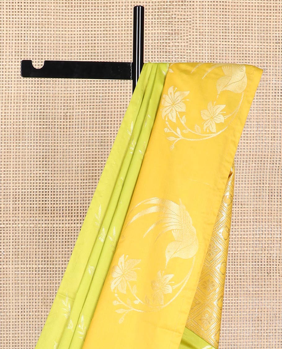 Light green leaf design soft silk saree with contrast zari design border & floral enclosed checked design pallu