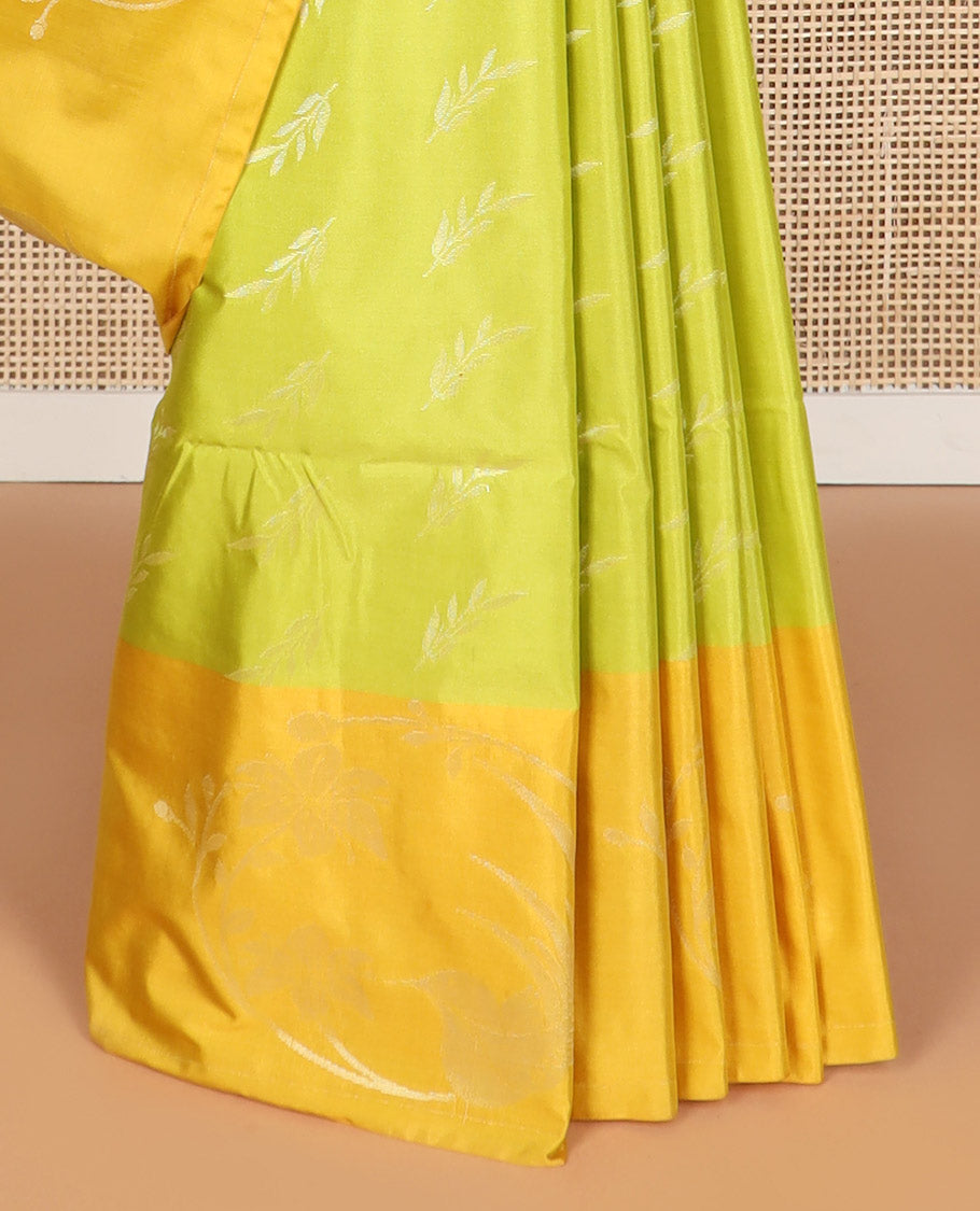 Light green leaf design soft silk saree with contrast zari design border & floral enclosed checked design pallu