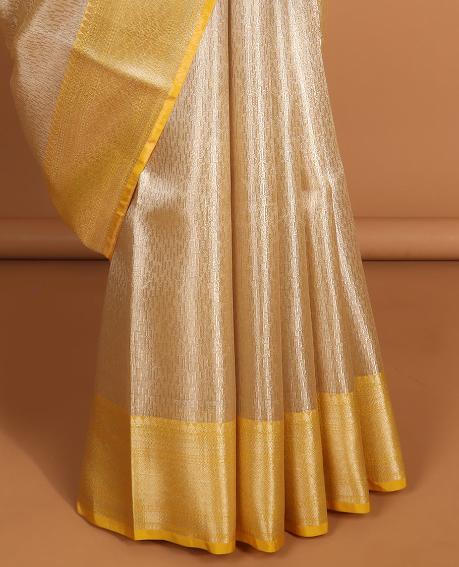 Beige motifs semi tissue saree with contrast zari design border & intricate zari design pallu