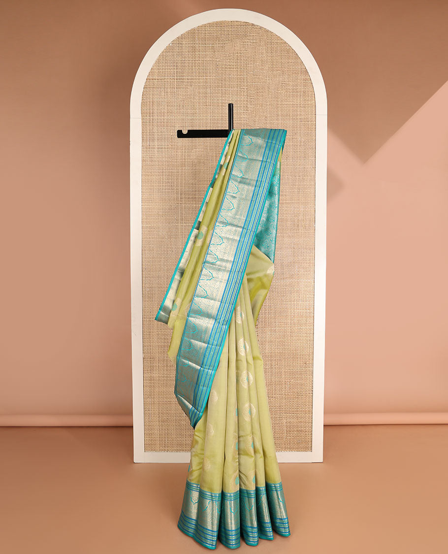Light green floral buttas vasundhara elite silk saree with contrast intricate zari design border & floral zari design pallu