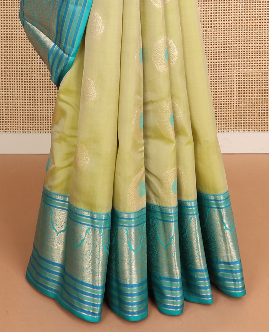 Light green floral buttas vasundhara elite silk saree with contrast intricate zari design border & floral zari design pallu