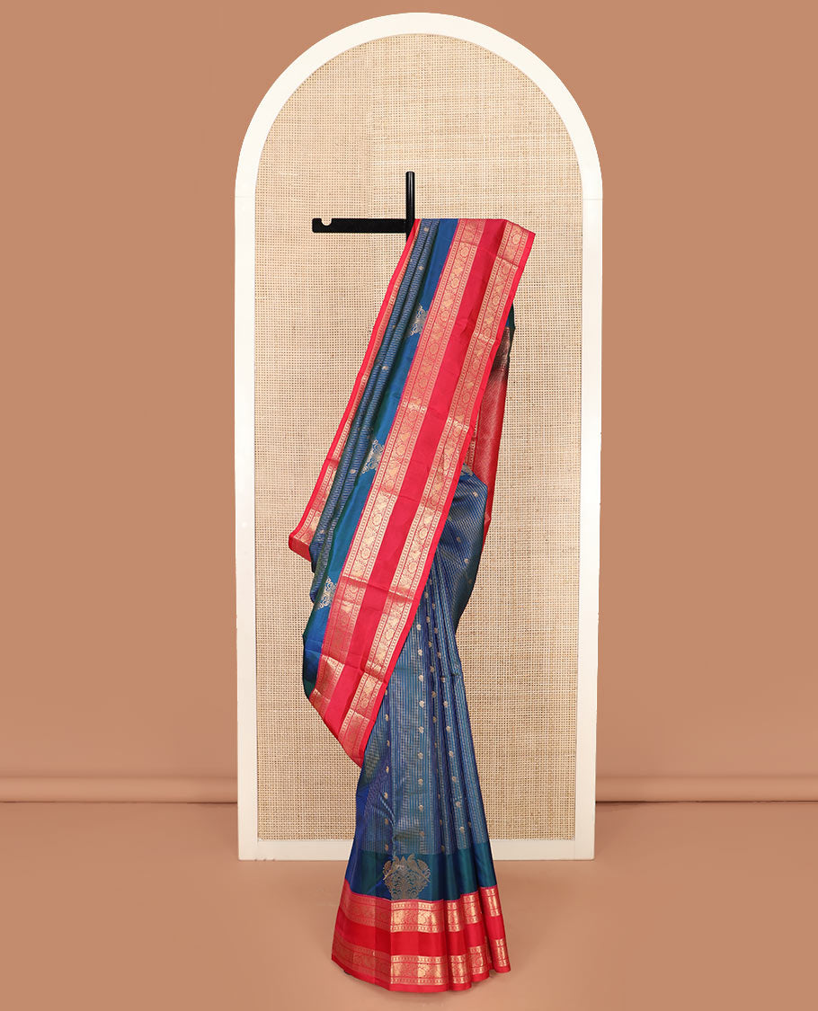 Blue Vasundhara Silk Saree Elegantly Detailed with Zari Buttas and Zari Micro-Checks, Complemented by a Contrast Rettai Pettu Border of Muthu, Rudraksham, and Kodi Mayil Designs, Pallu Steeped Kathir Designs, and a Contrast Blouse