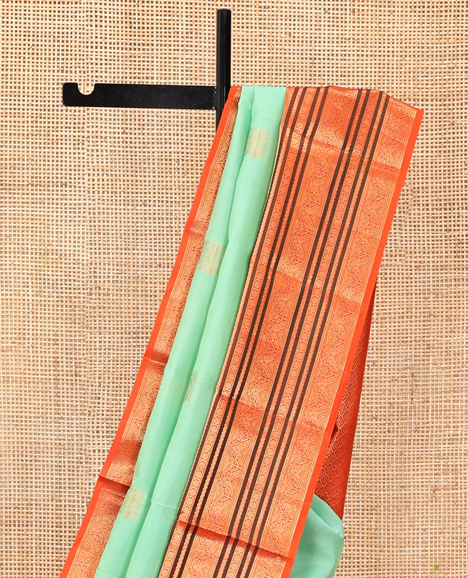 Turquoise Vasundhara Silk Saree, Finely Crafted with Zari Buttas, Complemented by a Contrast Border of Mayil, Neli, and Rudraksham Designs, Grand Pallu, and a Contrast Blouse