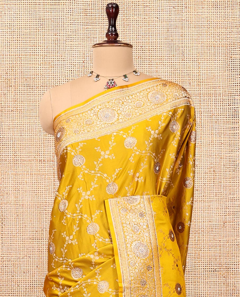 Yellow Banarasi Satin Saree, Subtly Sparkled with Floral Jaal Jacquard, a Floral Creeper Border, Intricate Stonework Pallu, and a Matching Blouse