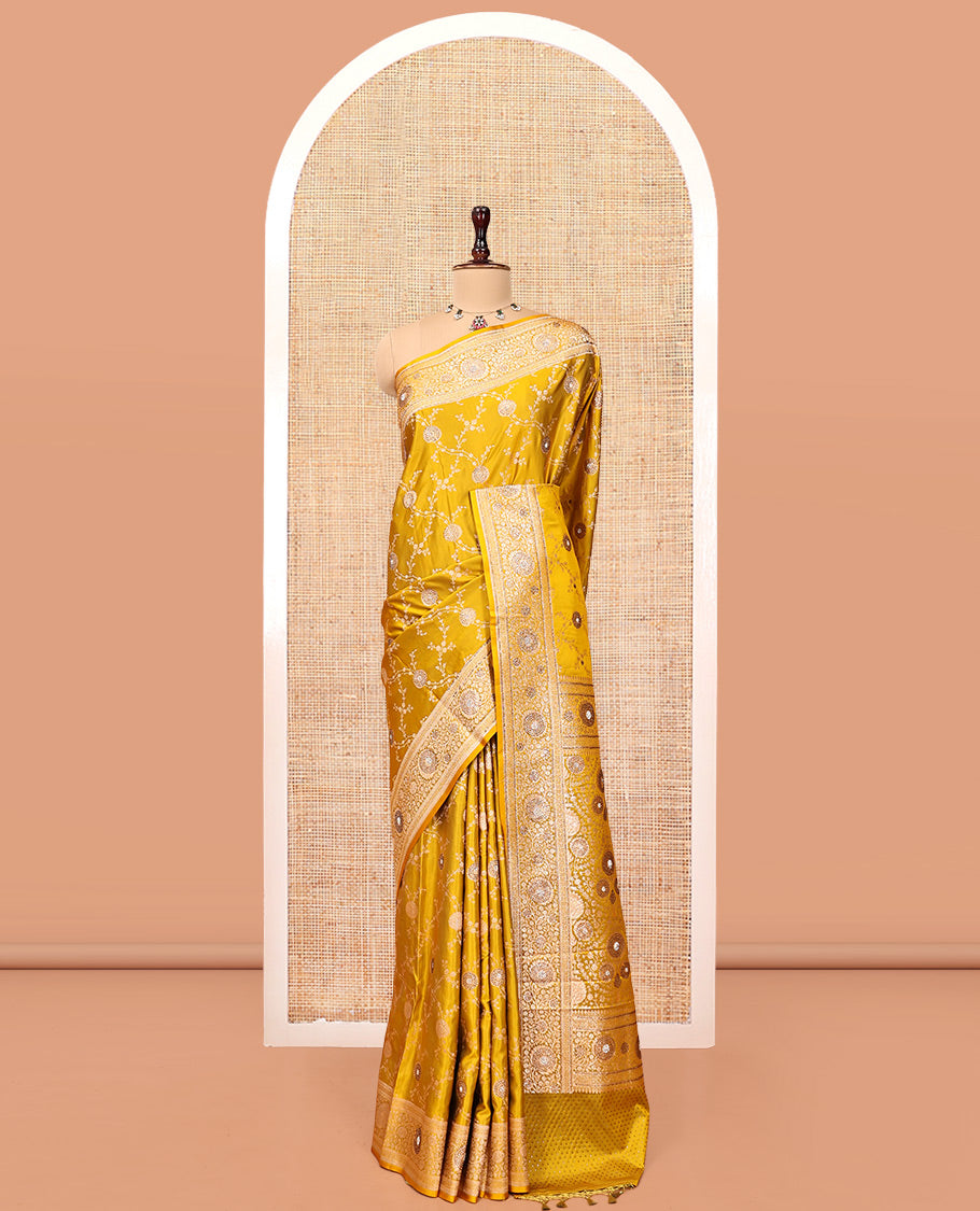 Yellow Banarasi Satin Saree, Subtly Sparkled with Floral Jaal Jacquard, a Floral Creeper Border, Intricate Stonework Pallu, and a Matching Blouse