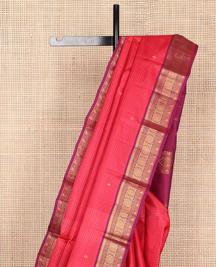 Pink striped and buttas Kanchipuram silk saree, contrast border of thilakam mokku, muthu, jadai nagam, and kili motifs and traditional zari design pallu