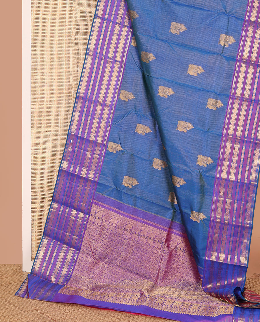 Blue striped and mayil buttas Kanchipuram silk saree, contrast border of thilakam mokku, mayil, and meen designs and annam chakram butta enclosed checked pallu