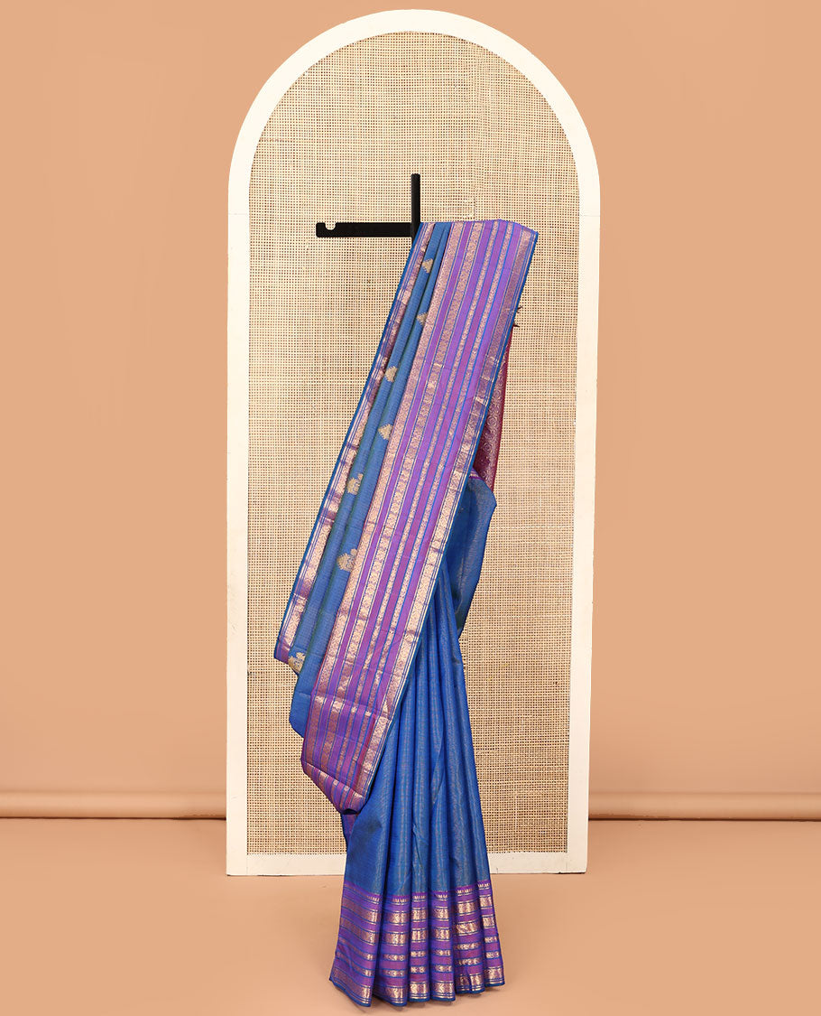 Blue striped and mayil buttas Kanchipuram silk saree, contrast border of thilakam mokku, mayil, and meen designs and annam chakram butta enclosed checked pallu