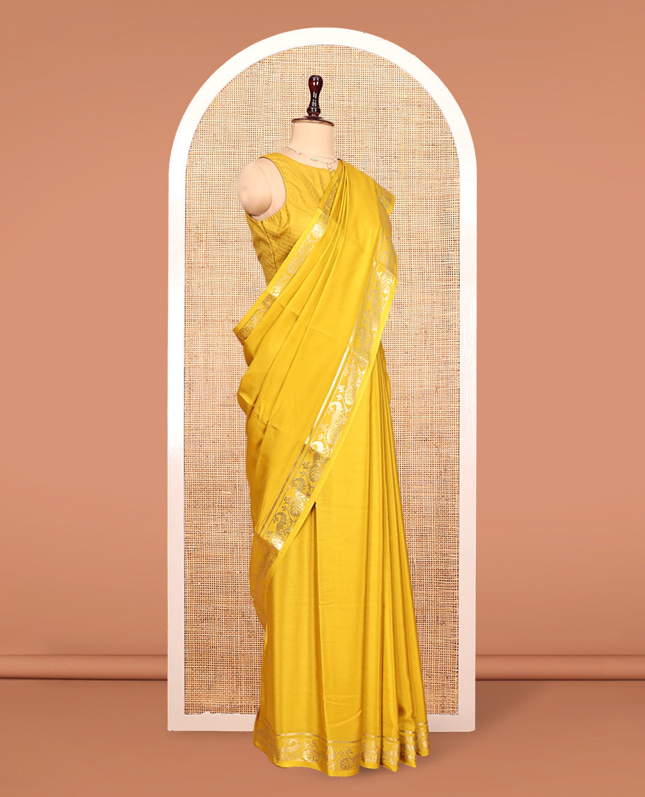 Yellow Plain Mysore Silk Saree, Highlighted by Zari Traditional Border of Peacock Designs, Pallu Steeped with Zari Stripes, and Paired with a Matching Blouse