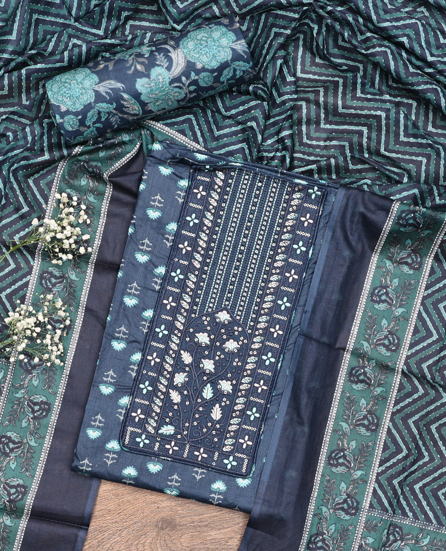 Blue Cotton Material Chudidar Set, Adorned with Floral Motifs Block Print, and Neck Embroidery on Its Cotton Top, a Floral Printed Bottom, and Paired with Chevron Printed Cotton Dupatta