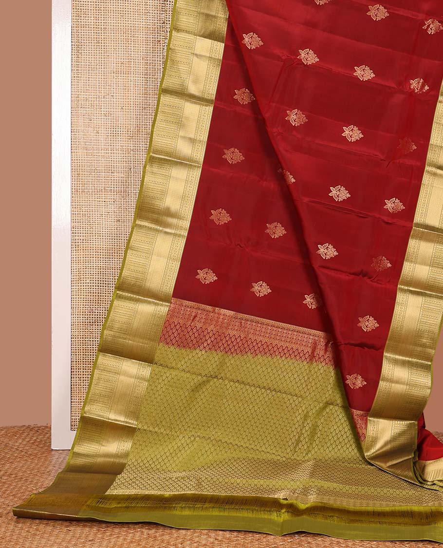 Red zari buttas Vasundhara silk mix saree, contrast border of rekku, poun, mayil kann, neli, and manga designs, and intricate pallu