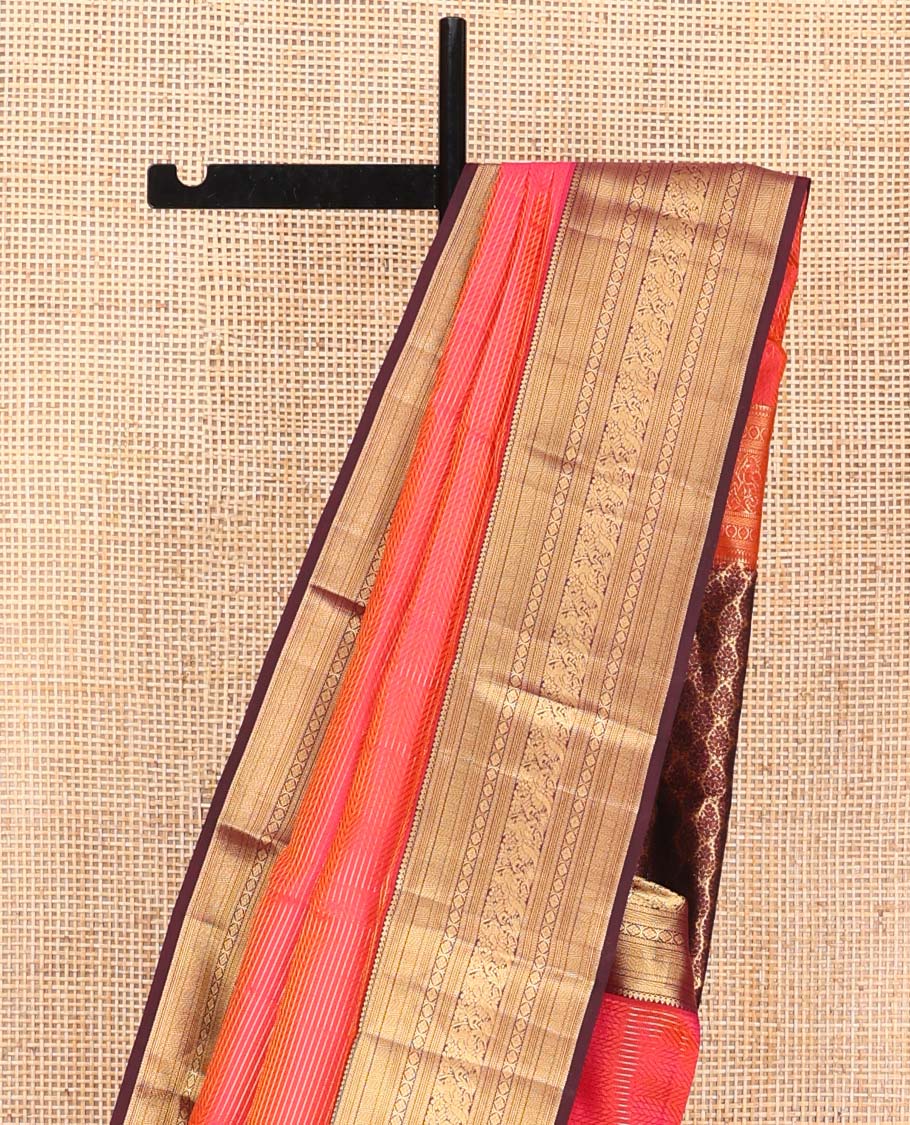 Pink Vasundhara Silk Saree, Beautifully Bedecked with Zari Stripes on Its Body, Complemented by a Contrast Border of Thilakam Mokku, Kathir, Vanki, Mayil, and Laddu Kamalam Designs, Majestically Detailed Jaal Pallu, and Paired with a Contrast Blouse
