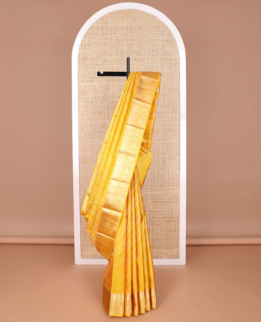 Yellow geometric design kancheepuram silk saree with self border of rekku, banaras, paun design & floral pallu