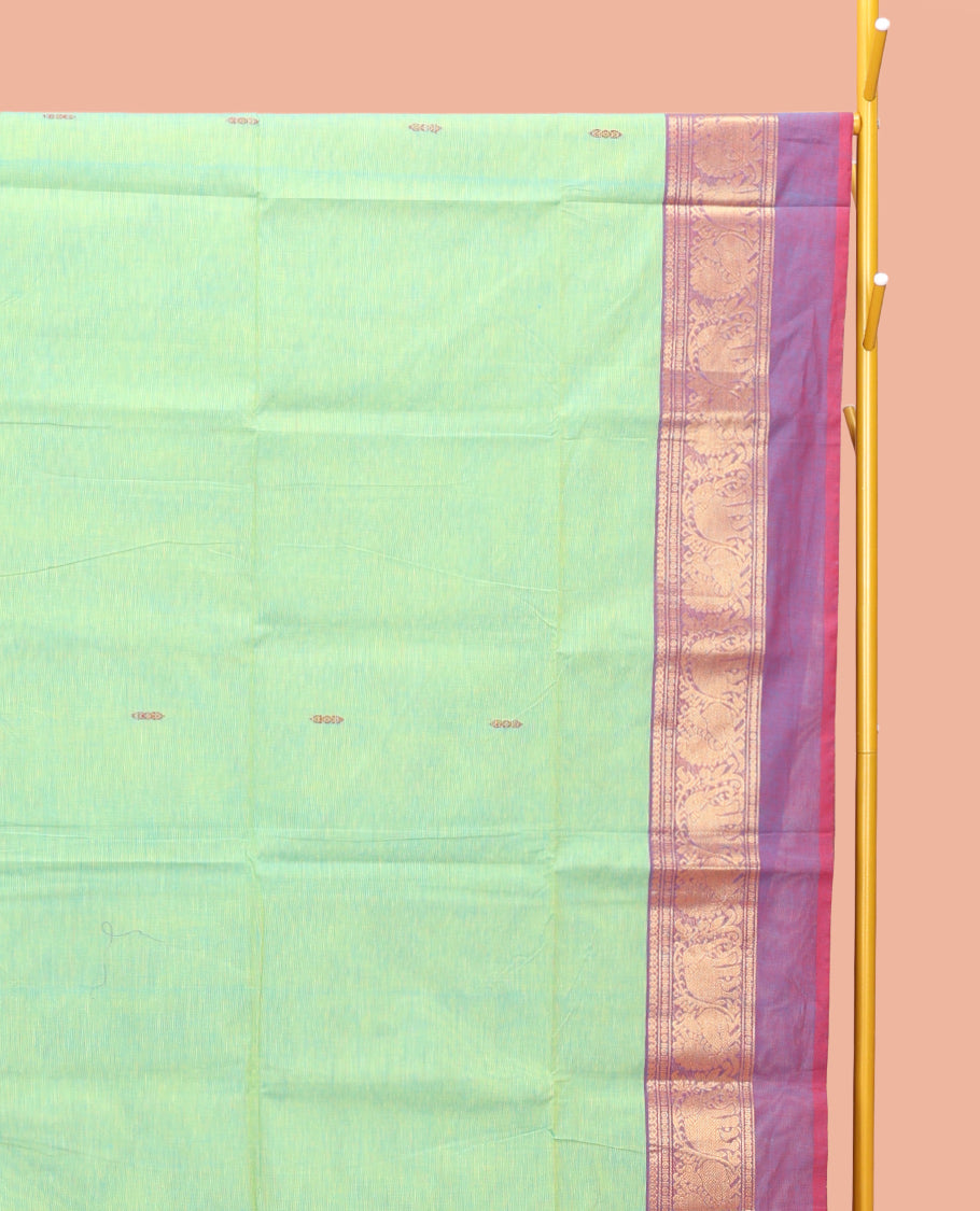 Green Chettinad Cotton Saree, Delicately Woven with Thread Buttas All Over Its Body, Complemented by a Contrast Ganga-Jamuna Kal Eragina Border of Kodi Peacock and Elephant Designs, Pallu of Buttas and Stripes, and Paired with a Matching Blouse