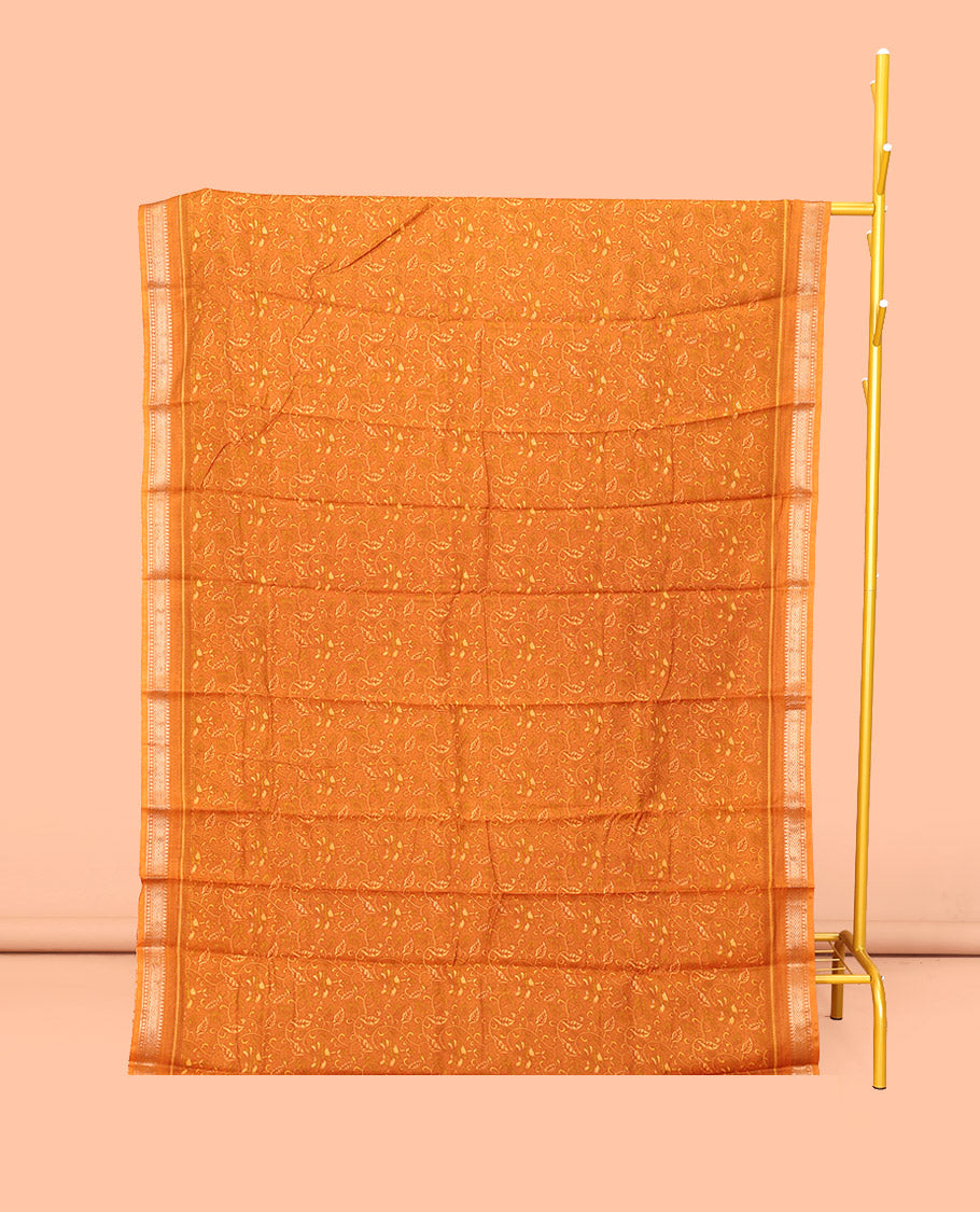 Orange Mul Mul Cotton Saree, Detailed with Leaf Print, a Subtle Traditional Border, a Floral-Printed Pallu, and a Matching Blouse