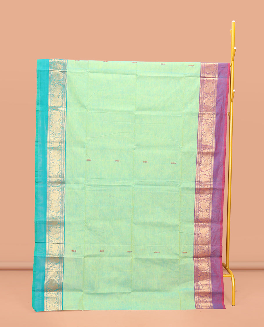 Green Chettinad Cotton Saree, Delicately Woven with Thread Buttas All Over Its Body, Complemented by a Contrast Ganga-Jamuna Kal Eragina Border of Kodi Peacock and Elephant Designs, Pallu of Buttas and Stripes, and Paired with a Matching Blouse