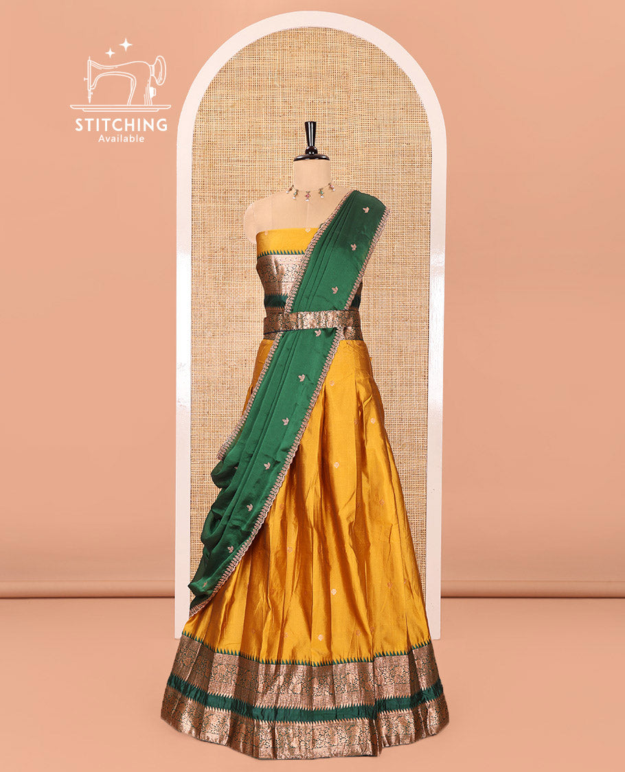 Yellow-Green Semi-Banarasi Half-Saree Subtly Sparkled with Zari Buttas on Its Skirt, Complemented by a Contrast Traditional Zari Temple Rettai Pettu Border, Paired with a Matching Blouse, and a Satin Georgette Embroidered Scallop Dhavani