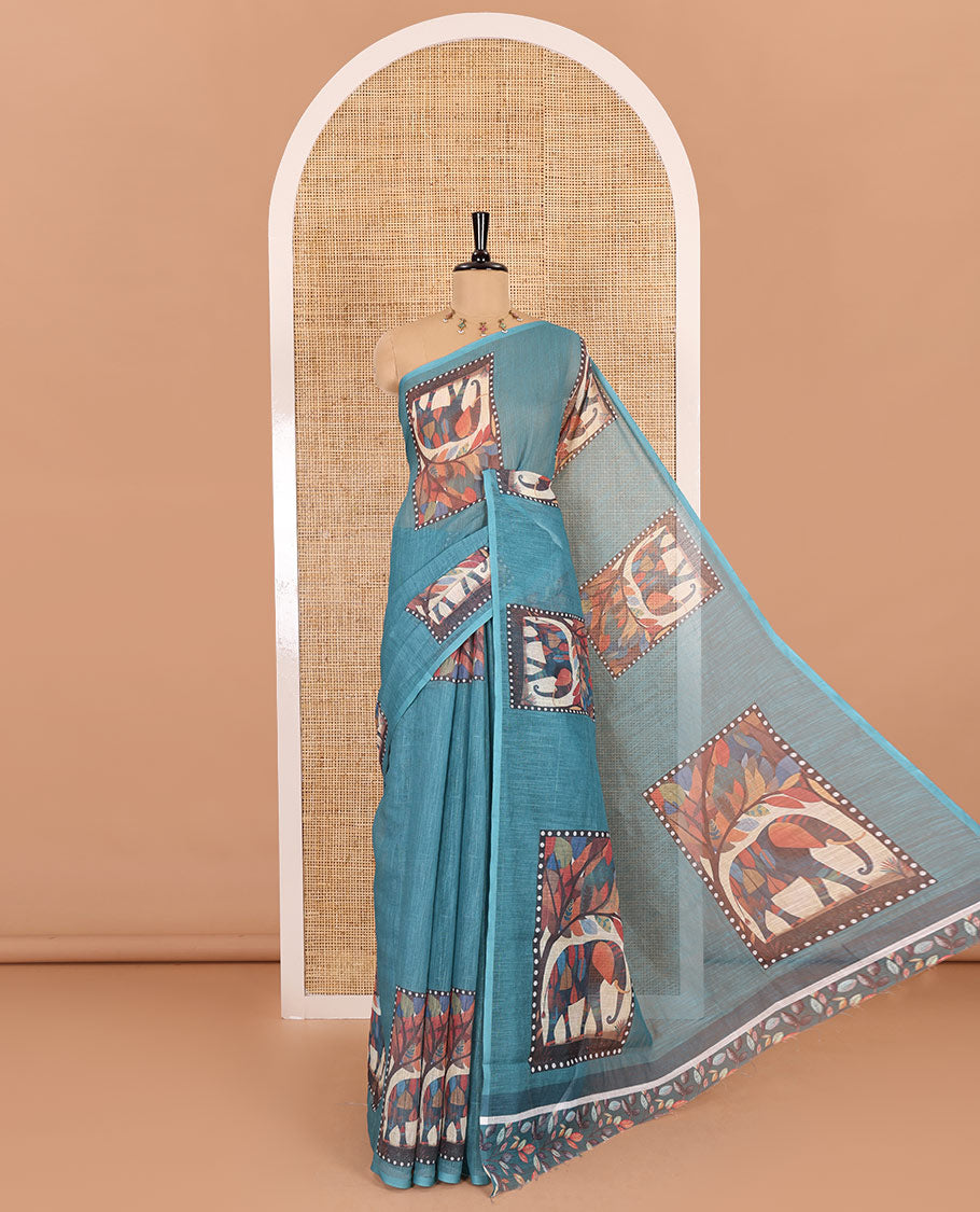Blue plain linen cotton saree, mordern art style elephant motifs printed border, elephant printed pallu, and a leaf printed blouse