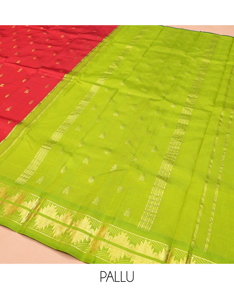 Red Kanchipuram Silk Saree, Detailed with Zari Buttas on Its Body, Complemented by a Contrast One-Sided Korvai Border of Thazampoo Rekku Designs, Pallu Depicts Zari Designs, and Comes Without a Blouse