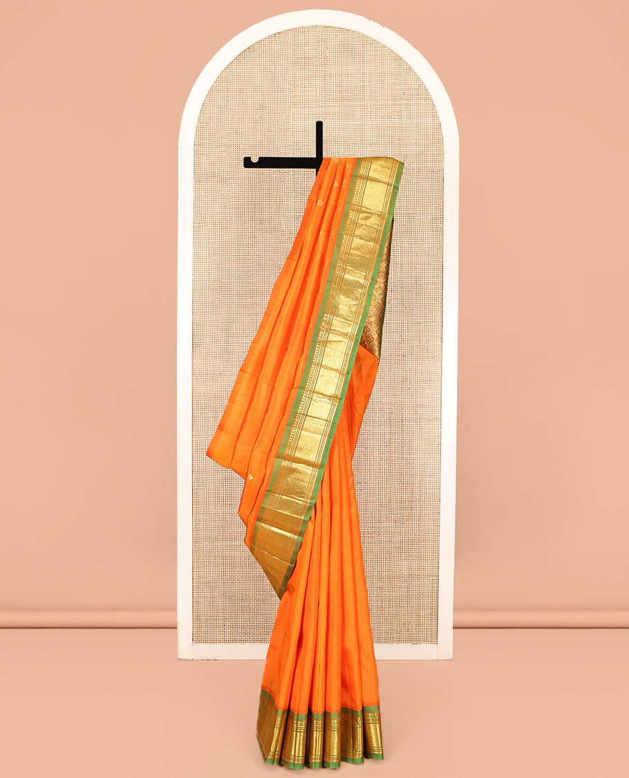Orange Kanchipuram Silk Saree, Crafted with Zari Buttas, Complemented by a Contrast One-Sided Border of Panner Sombu, Banaras, Muthu and Mayil Kann Designs, Grand Jaal Pallu, and No Blouse