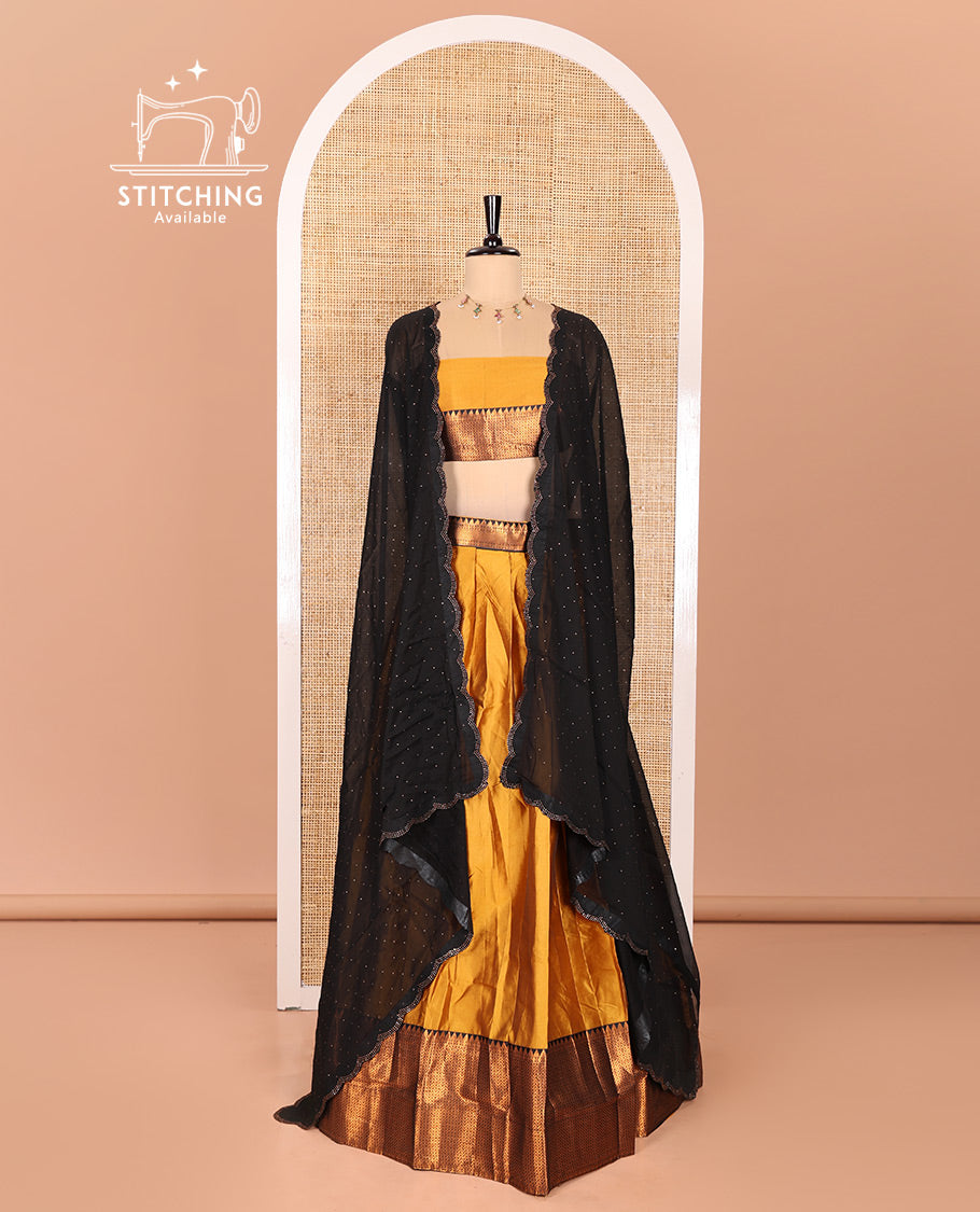 Mustrad Taffeta Silk Half-Saree Featuring a Plain Skirt, Adorned with a Contrast Traditional Zari Design Border, Paired with a Matching Blouse, and a Georgette Scallop-Bordered Stone Work Dhavani