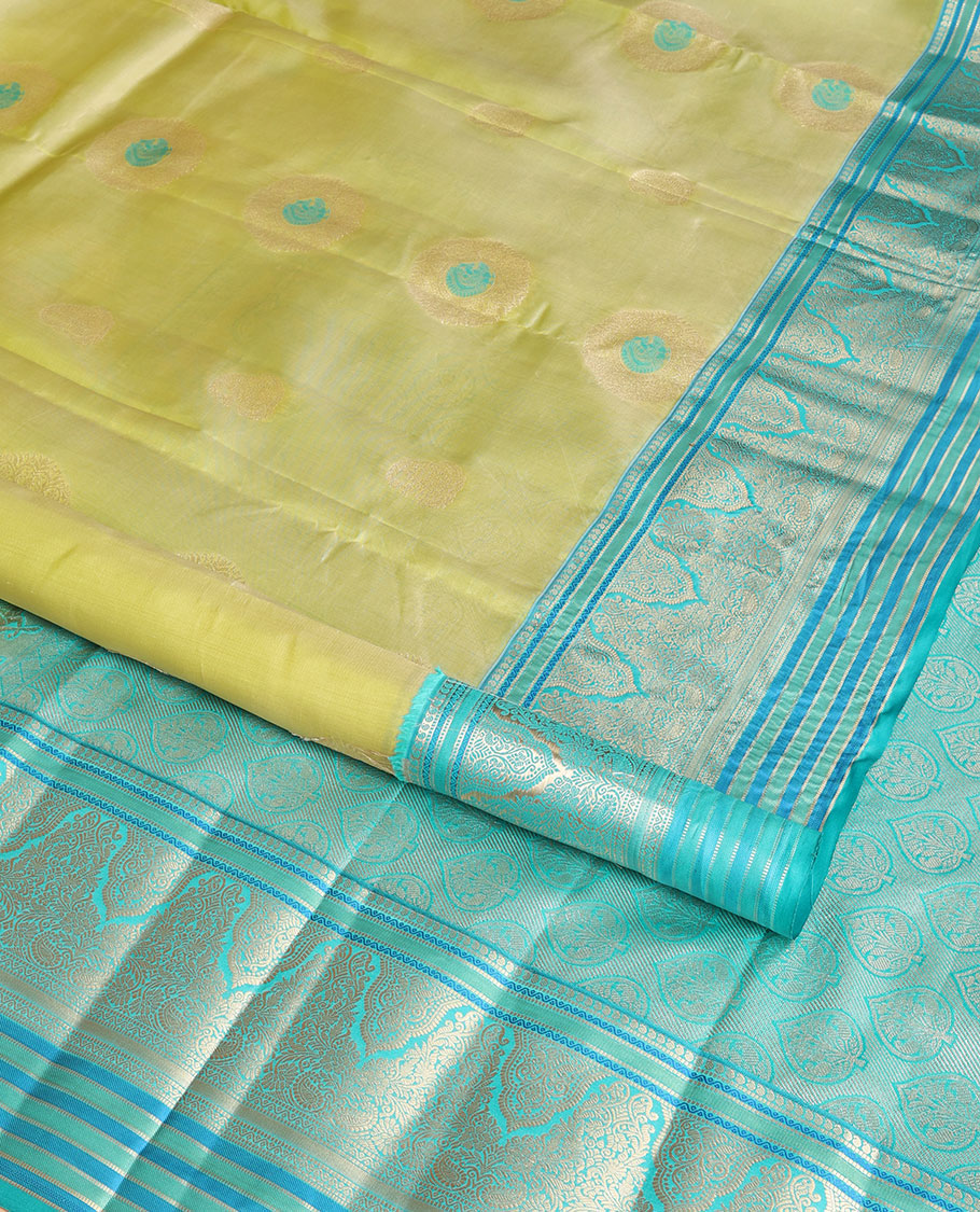 Light green floral buttas vasundhara elite silk saree with contrast intricate zari design border & floral zari design pallu