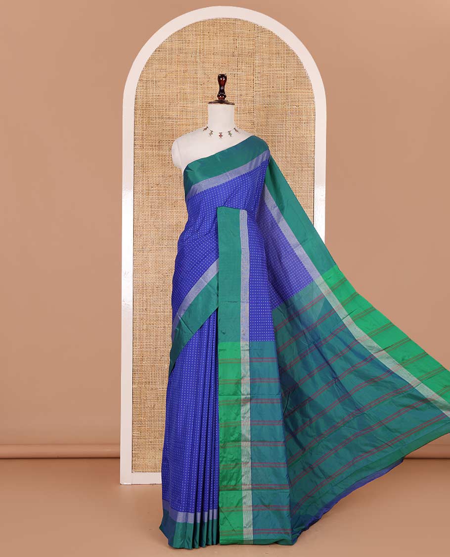 Royal blue-green plus-shaped buttas steeped semi-soft silk saree, contrast satin border of stripes, striped pallu, and contrast blouse