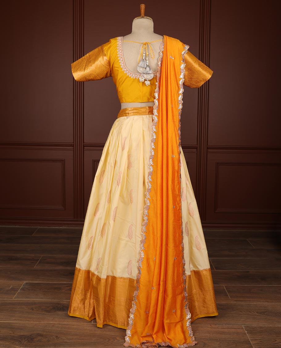 Cream paisley half saree witn contrast zari design border, floral embroidery blouse & floral embroidery dhavani