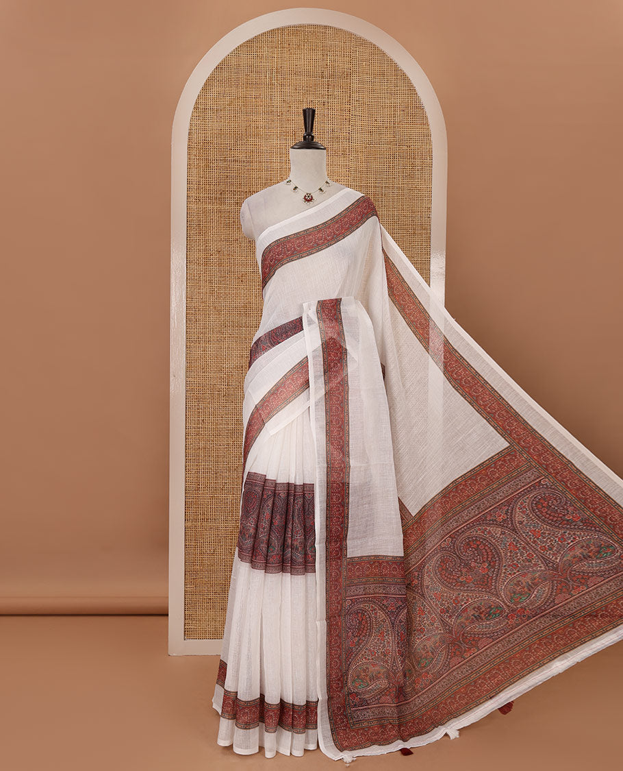 White half-plain & half-printed linen cotton saree, brown-color printed border, paisley motifs printed pallu & uniquely printed blouse
