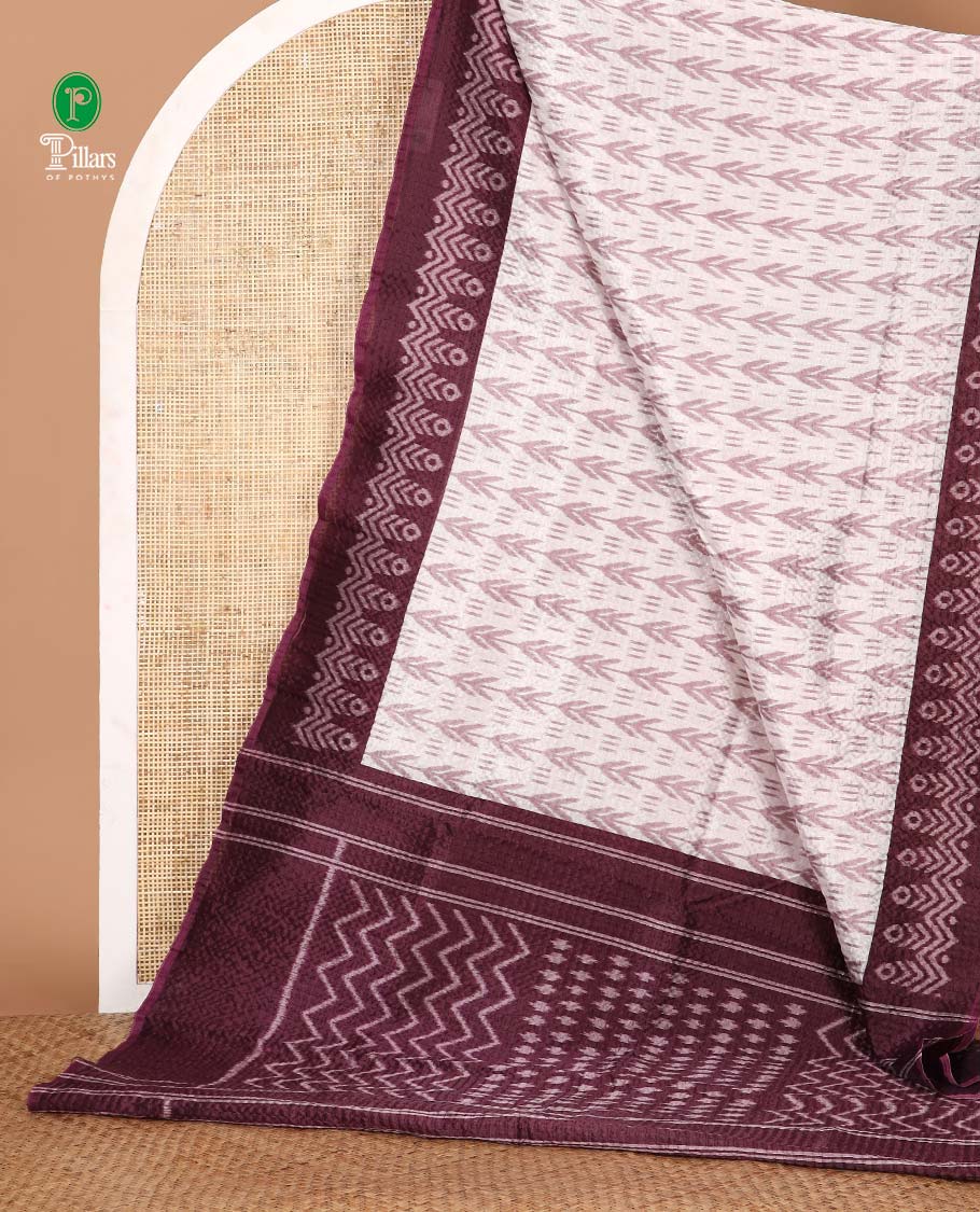 White ikat-style printed Litchi crushed saree, contrast purple ikat border, pallu of ikat chevron & dots & ikat printed blouse