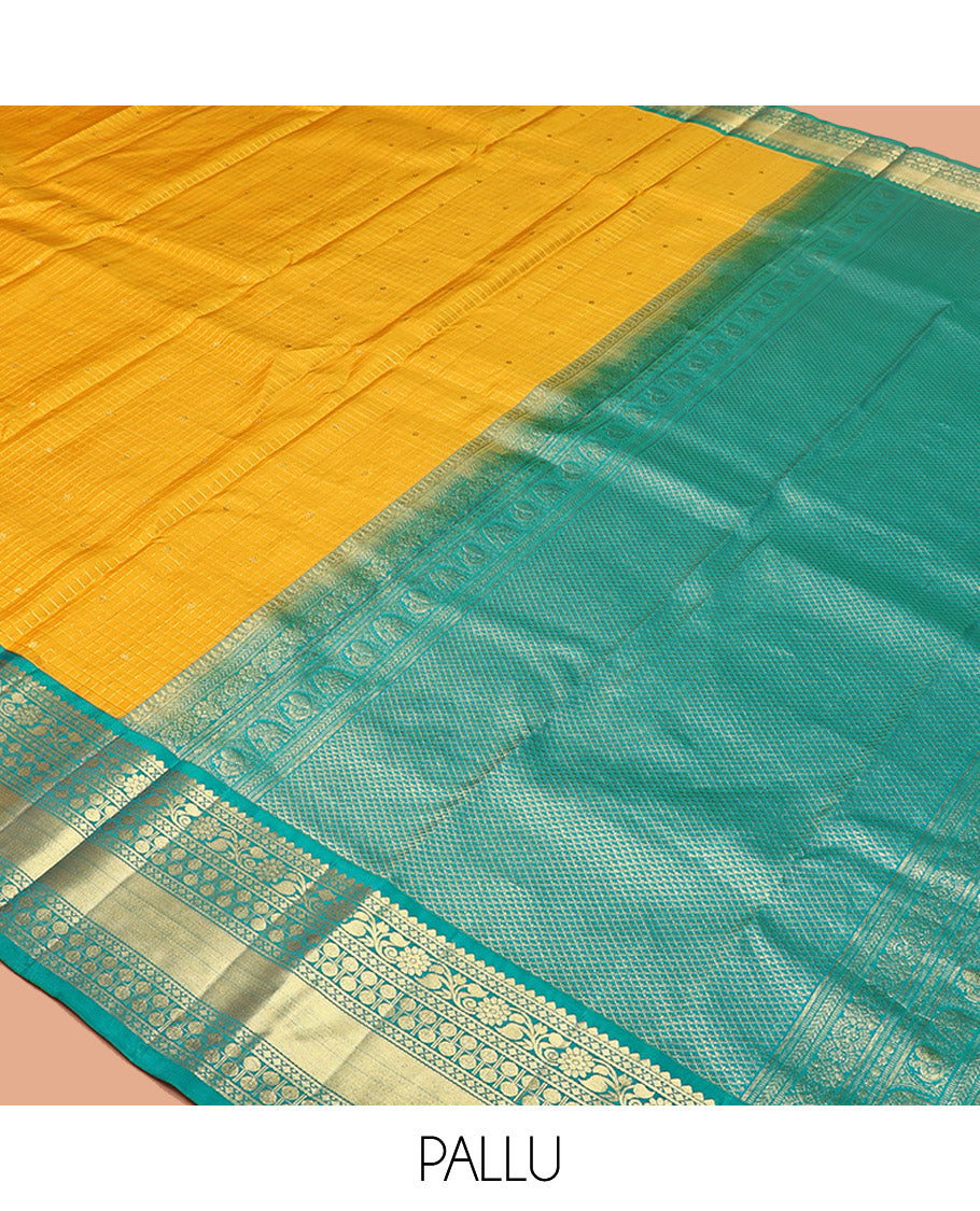Yellow Vasundhara Silk Saree, Subtly Sparkled with Zari Buttas and Checks All Over Its Body, Complemented by a Contrast Border of Thilakam, Diamond, Kodi Visiry, and Poun Designs, Grand Pallu, and Paired with a Contrast Blouse
