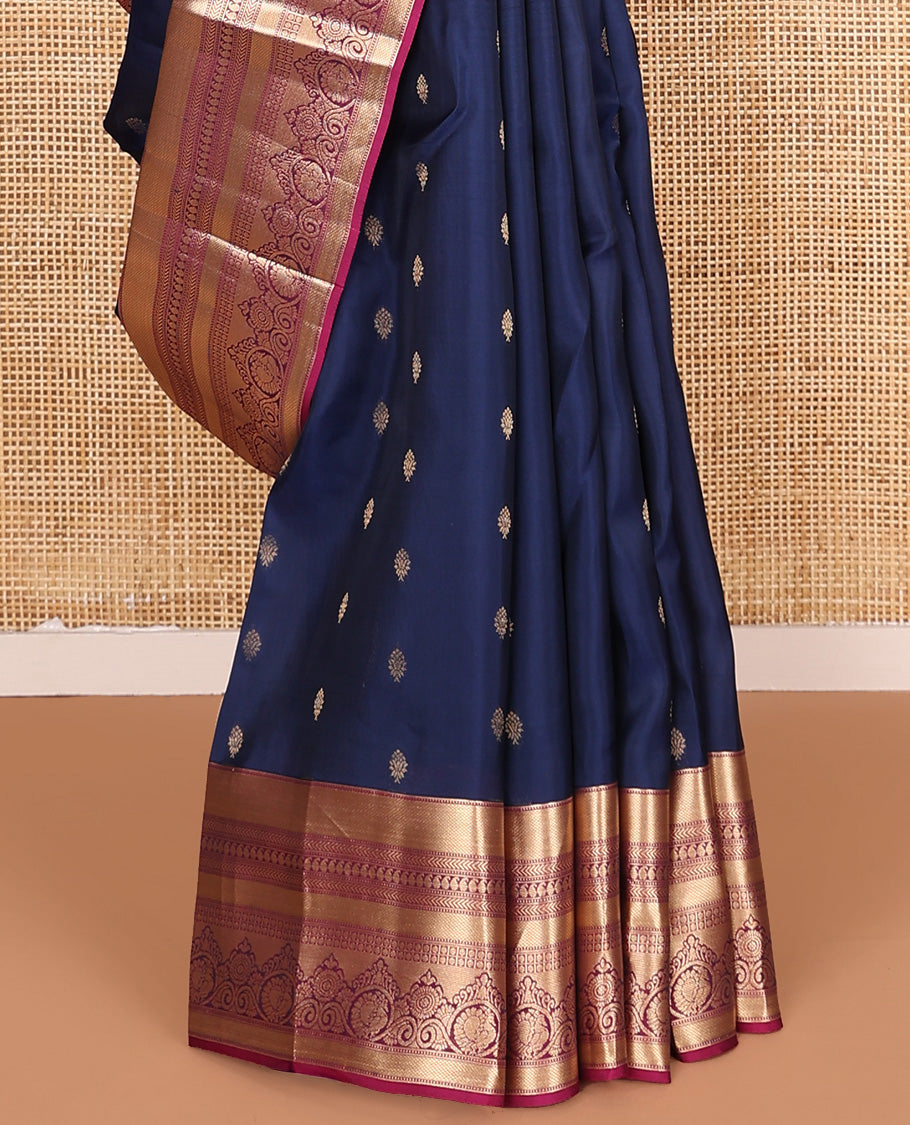 Navy blue zari buttas Vasundhara silk mix saree, contrast border of muthu, kuyil kann, kathir, manga, and mayil chakram designs, and floral design pallu