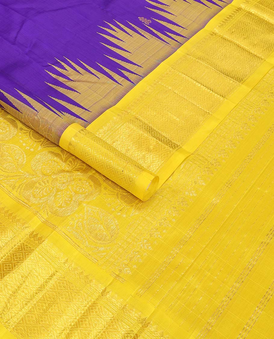 Blue buttas kancheepuram silk saree with contrast border of rekku, thilakam mokku, banaras design & zari design pallu