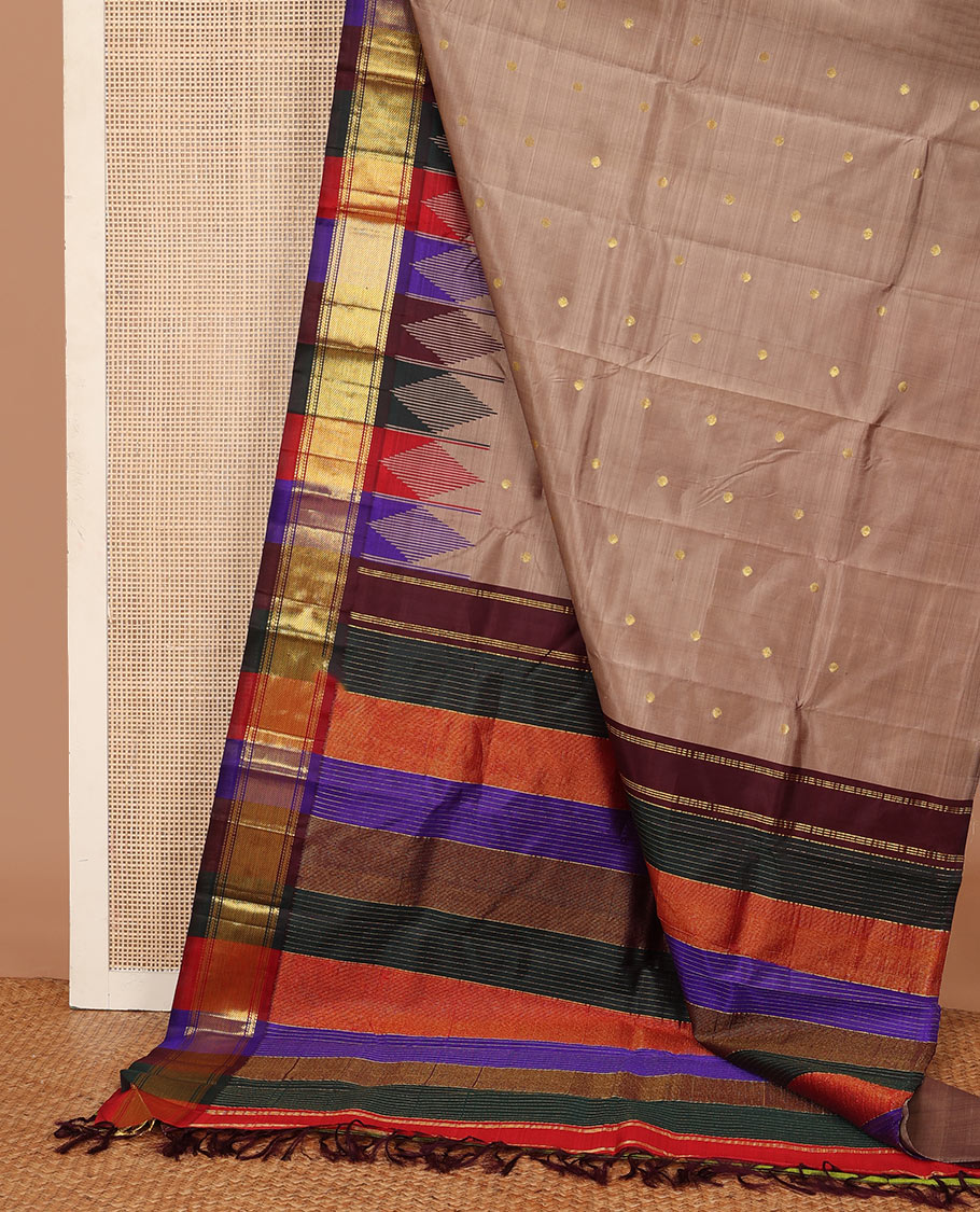 Brown zari buttas Kanchipuram silk saree, contrast multi-colored one-sided thazampoo rekku zari border, and multi-colored zari striped pallu