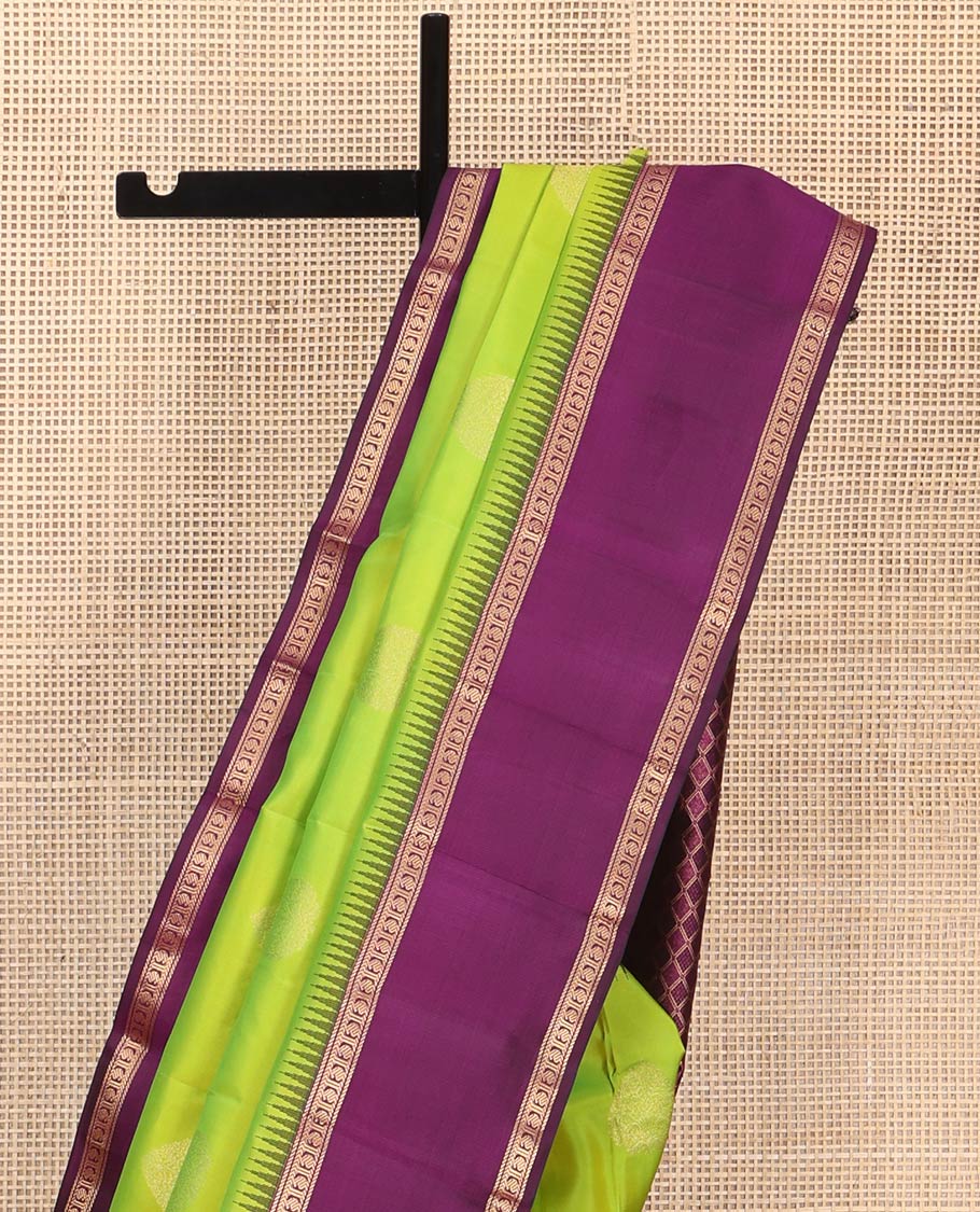 Green Vasundhara Silk Saree, Delicately Woven with Zari Buttas All Over Its Body, Complemented by a Contrast Rettai Pettu Temple Border of Banaras, and Manga Designs, Grand Jaal Pallu, and Paired with a Contrast Blouse
