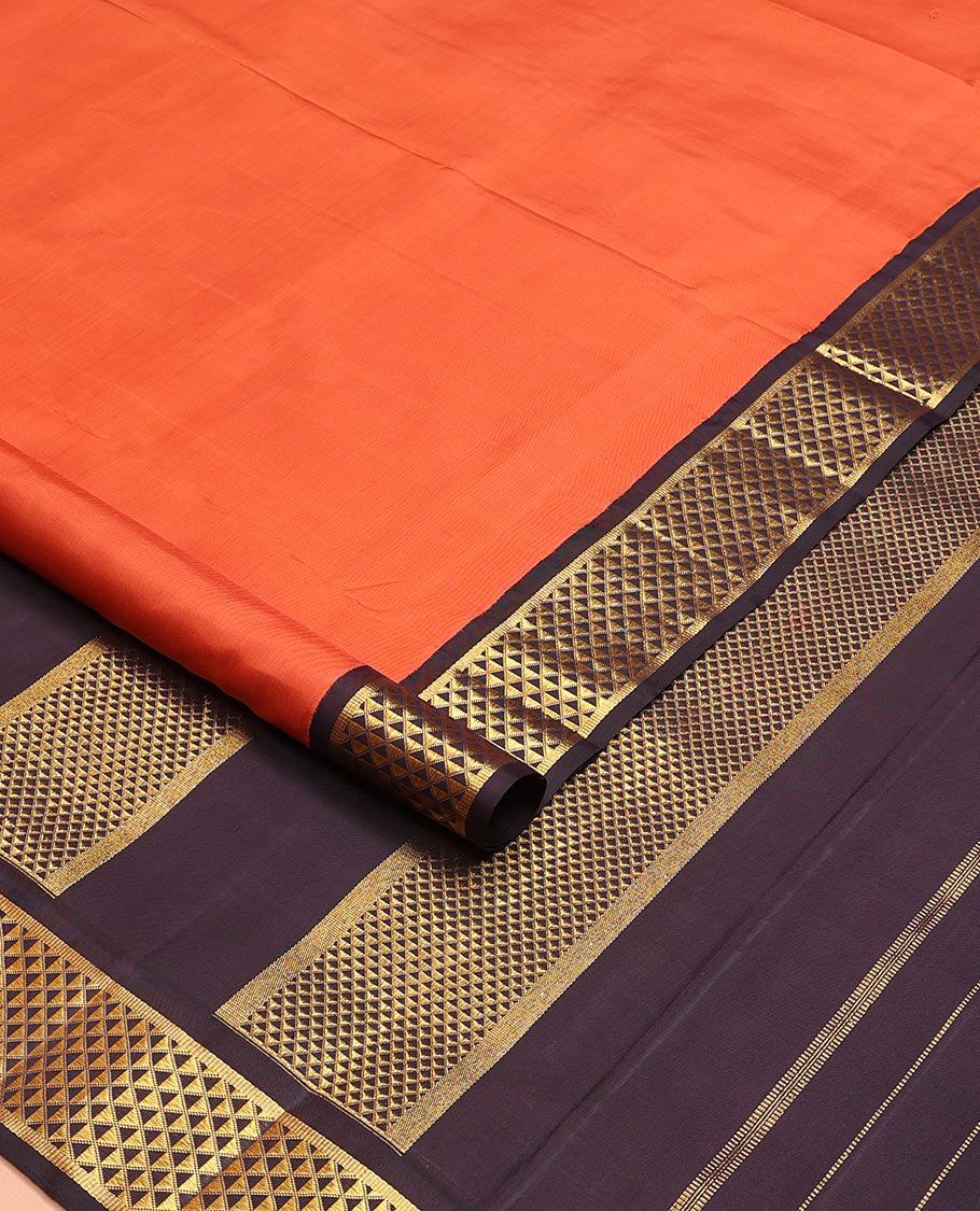 Orange plain nine-yard silk saree, contrast ara maadam design korvai border, and pallu of ara maadam designs