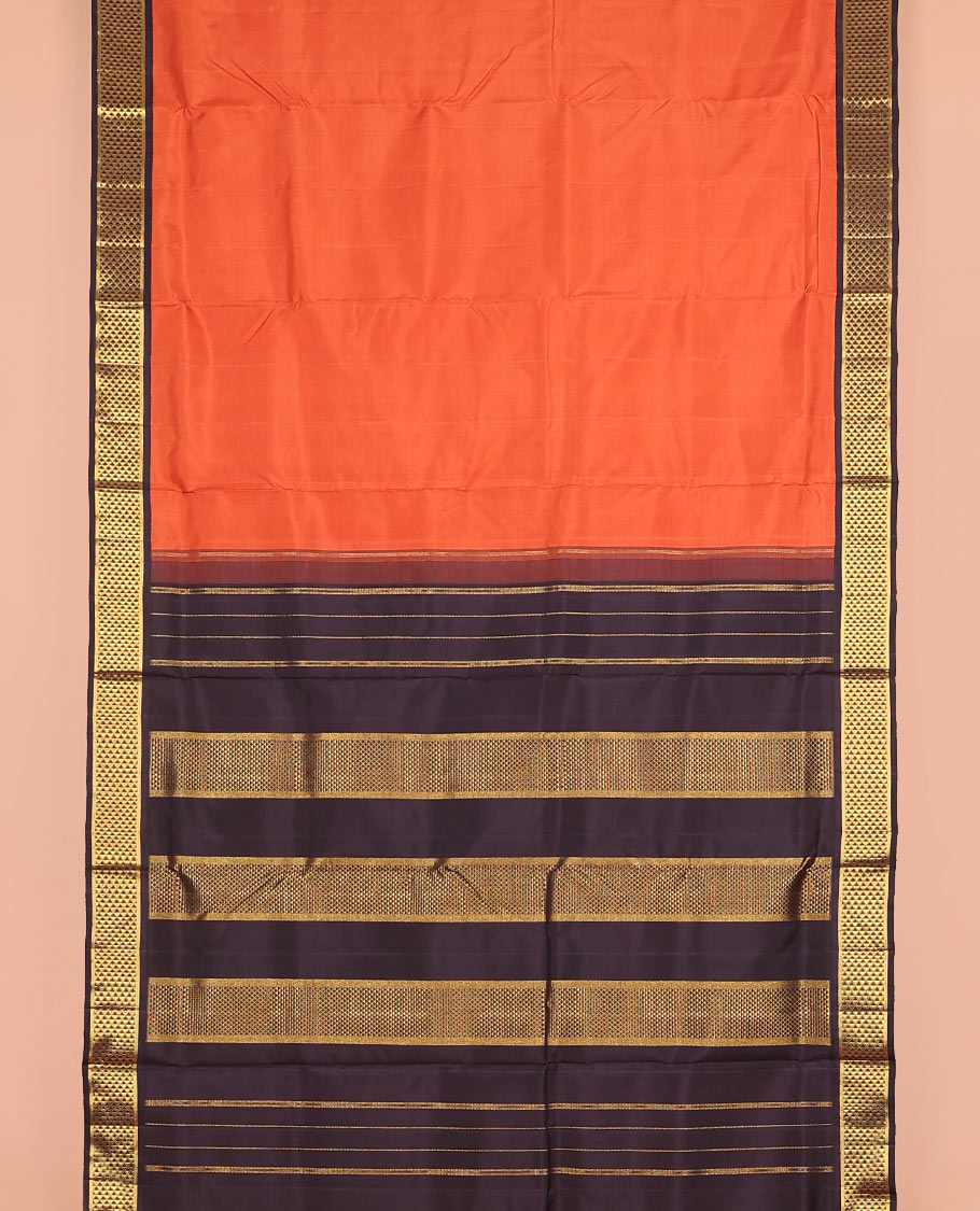 Orange plain nine-yard silk saree, contrast ara maadam design korvai border, and pallu of ara maadam designs