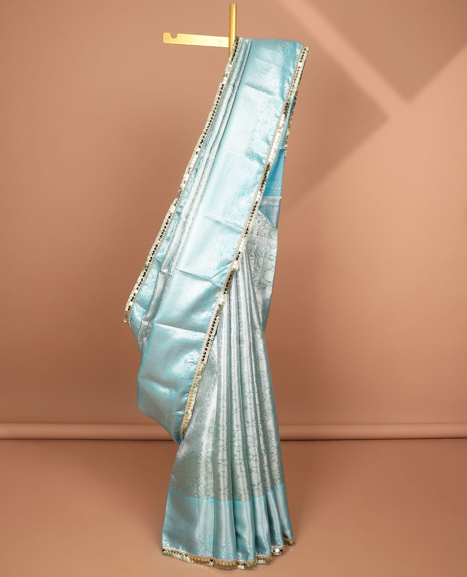 Light blue jacquard tissue saree with self floral zari design border & intricate zari design pallu