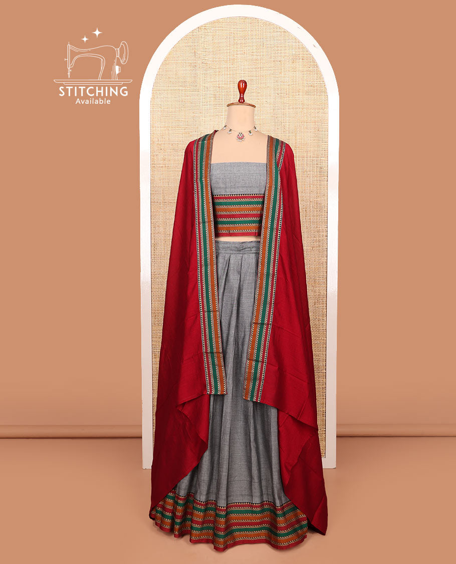 Grey plain cotton half-saree with contrast traditional motifs woven thread bordered skirt, matching blouse, and a contrast traditional bordered dhavani