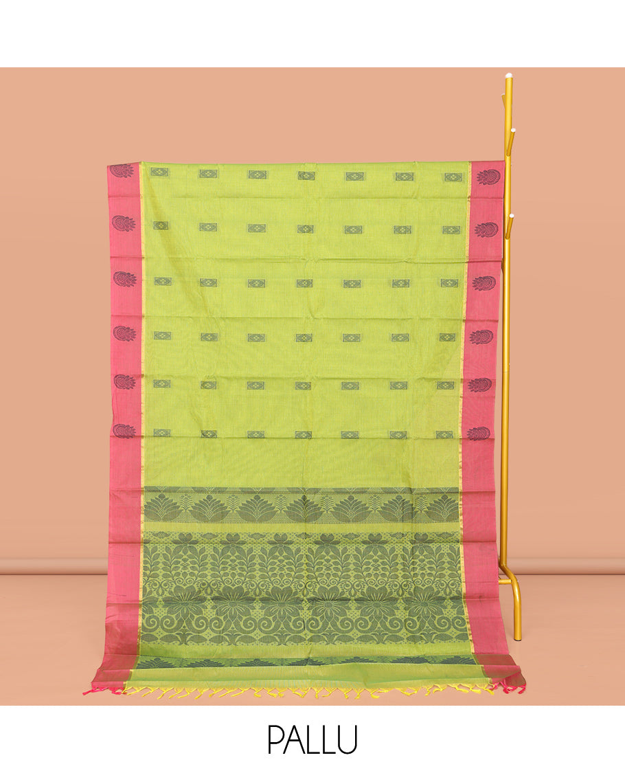 Leaf Green Kanchi Cotton Saree, Crafted with Buttas All Over Its Body, Complemented by Contrast Border, Pallu of Floral Designs, and Paired with a Matching Blouse