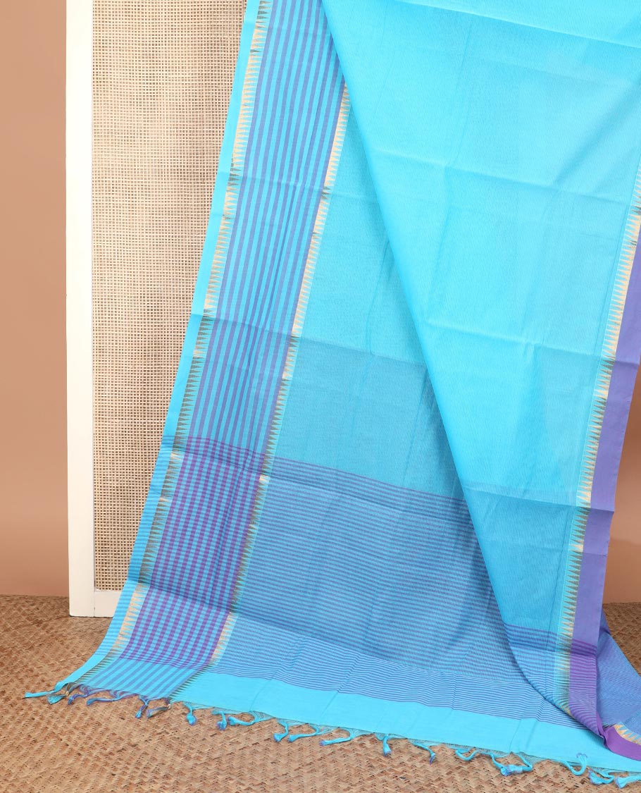 Blue plain Mangalagiri cotton saree with temple zari border of horizontal stripes, striped pallu, and a contrast kalamkari floral printed blouse