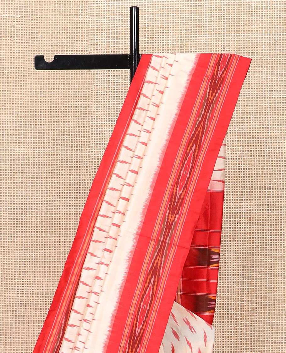 Cream Ikkat Silk Saree with Buttas Across the Body, Highlighted by a Contrast Ikkat-Textured Border, and Pallu Features Stripes and Ikkat Texture