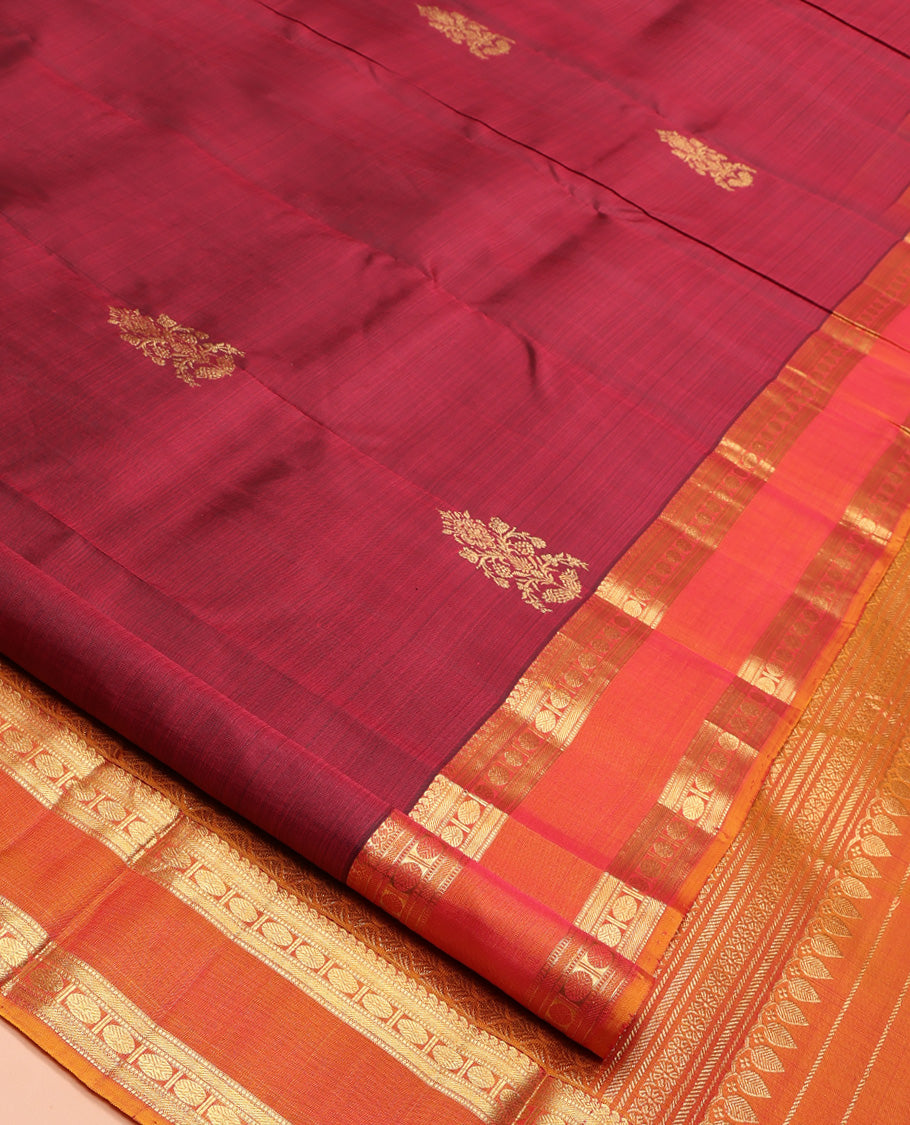 Red Kanchipuram Silk Saree, Enriched with Zari Buttas All Over Its Body, Complemented by Contrast Rettai Pettu Border of Manga Mokku, Muthu, Banaras, and Poun Designs, Grand Pallu, and Paired with a Contrast Blouse