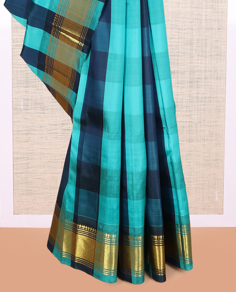 Blue Checked Kanchipuram Silk Saree, a Zari One-sided Border of Paneer Sombu, Banaras, Muthu, and Mayil Kann Designs, Pallu of Zari Designs, and No Blouse