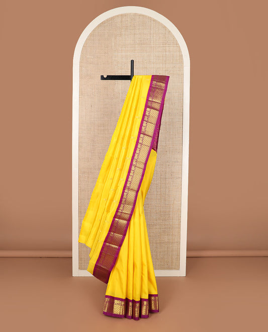 Yellow zari buttas Kanchipuram silk saree, contrast korvai border of mayil & geometric patterns & floral jaal pallu