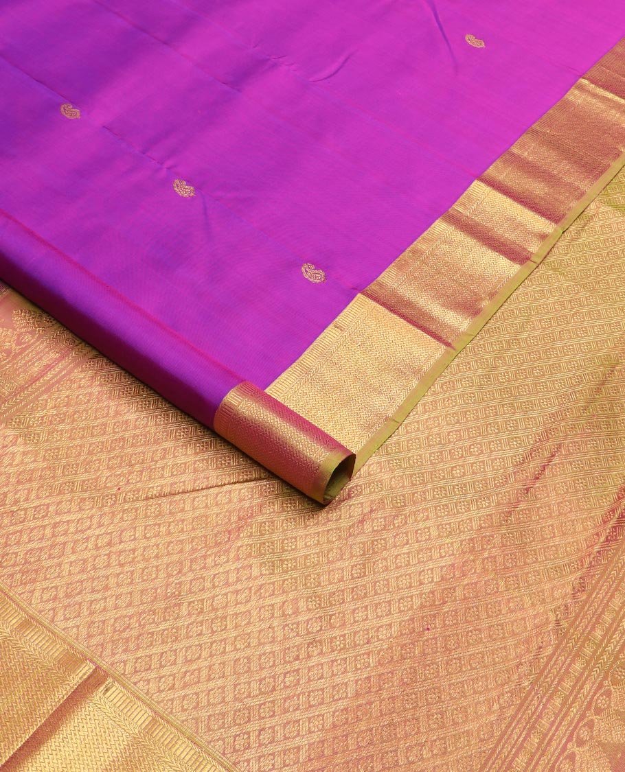 Rani pink zari buttas Kanchipuram silk saree, contrast traditional zari border, and kamalam designs steeped pallu