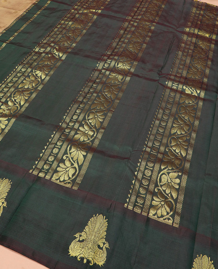 Brown zari buttas Kanchipuram silk saree, contrast thazampoo rekku border of mayil designs, and pallu of rekku, rudraksham, and kodi visiry designs