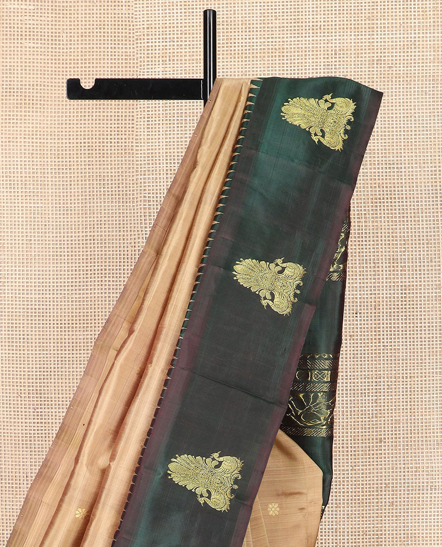 Brown zari buttas Kanchipuram silk saree, contrast thazampoo rekku border of mayil designs, and pallu of rekku, rudraksham, and kodi visiry designs