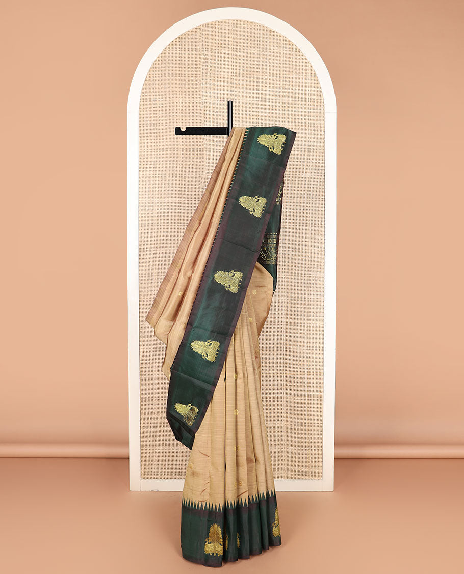 Brown zari buttas Kanchipuram silk saree, contrast thazampoo rekku border of mayil designs, and pallu of rekku, rudraksham, and kodi visiry designs